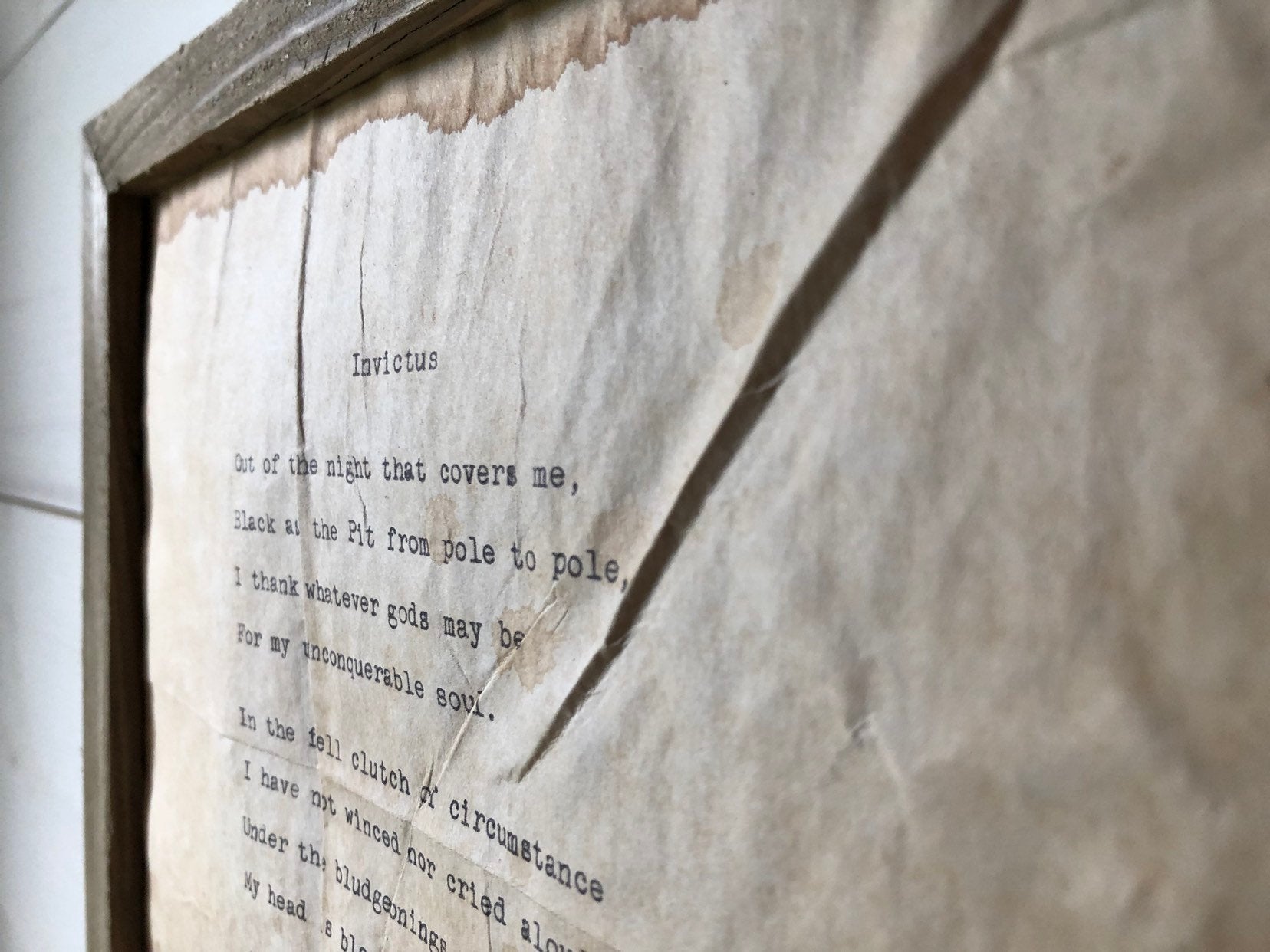 Invictus by William Ernest Henley Vintage Poem Print. Typewritten. Close up of rustic frame.