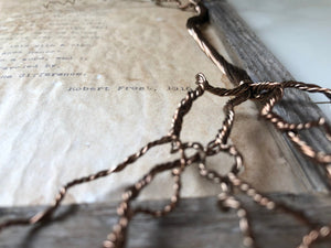 The Road Not Taken by Robert Frost. Vintage poem print. Typewritten. Framed in rustic wood with hand twisted copper wire tree. Close up of tree and distressed look.